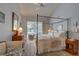 Bright bedroom with a four-poster bed and sliding glass doors to the outdoor area at 1069 Captains Way, Tarpon Springs, FL 34689