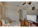 Bright office space featuring a comfortable chaise lounge and large storage closet at 1069 Captains Way, Tarpon Springs, FL 34689