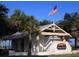 Quaint beach house under the US flag at Sunset Beach of Tarpon Springs at 1069 Captains Way, Tarpon Springs, FL 34689