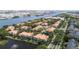 Expansive aerial showcasing waterfront condo community with pond fountain and lush landscaping at 1117 Shipwatch Cir, Tampa, FL 33602