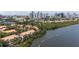 Beautiful aerial view showcases waterfront condos, mature trees, and a vibrant city skyline backdrop at 1117 Shipwatch Cir, Tampa, FL 33602