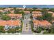 Aerial view of condominiums with red tile roofs surrounding community pool and location pin at 1117 Shipwatch Cir, Tampa, FL 33602