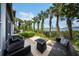 Backyard deck with seating area, a fire pit and water views at 1117 Shipwatch Cir, Tampa, FL 33602