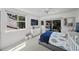 Comfortable bedroom with a bed, a bright window, and access to a balcony at 1117 Shipwatch Cir, Tampa, FL 33602