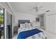 Bright bedroom with balcony access, a comfortable bed, and a charming white crib at 1117 Shipwatch Cir, Tampa, FL 33602