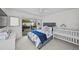 Bright bedroom with balcony access, a comfortable bed, and a charming white crib at 1117 Shipwatch Cir, Tampa, FL 33602