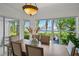 Bright dining room with a waterfront view and sliding glass door leading to the outdoor area at 1117 Shipwatch Cir, Tampa, FL 33602