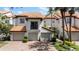 Charming townhomes with tile roofs, paved driveways, and attached two-car garages at 1117 Shipwatch Cir, Tampa, FL 33602