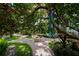 Paved pathway features mature trees and fountain with lush landscaping in a well maintained community at 1117 Shipwatch Cir, Tampa, FL 33602