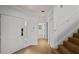 Entryway featuring tile floors, staircase, and hallway leading to the bedrooms at 1117 Shipwatch Cir, Tampa, FL 33602
