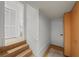 Hallway with tile floors leads to a bathroom with classic features and a closet for storage at 1117 Shipwatch Cir, Tampa, FL 33602