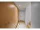 Hallway with tiled floor and storage closet features neutral paint and simple design at 1117 Shipwatch Cir, Tampa, FL 33602