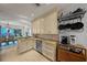 Kitchen featuring tile floors, stainless steel appliances, and views of the dining area and waterfront at 1117 Shipwatch Cir, Tampa, FL 33602