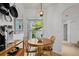 Cozy breakfast nook with a wooden table, chairs, and natural light from the window at 1117 Shipwatch Cir, Tampa, FL 33602