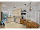 Well-lit kitchen with tile flooring, stainless steel appliances, and ample cabinet space at 1117 Shipwatch Cir, Tampa, FL 33602