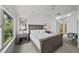 Well-lit bedroom with a comfortable bed, ample natural light, and view into an ensuite bathroom at 1117 Shipwatch Cir, Tampa, FL 33602