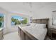 Main bedroom featuring serene water views, a comfortable bed, and stylish furnishings at 1117 Shipwatch Cir, Tampa, FL 33602