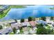 Aerial view showcases the neighborhood featuring lake views and manicured lawns at 11427 Laurel Brook Ct, Riverview, FL 33569