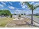 Large backyard with a firepit area, surrounded by a white fence at 11427 Laurel Brook Ct, Riverview, FL 33569