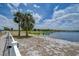 Backyard view with a lake and lush trees, perfect for relaxation at 11427 Laurel Brook Ct, Riverview, FL 33569