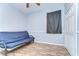 Light blue bedroom with a ceiling fan, wood floors, a closet, and a blue futon at 11427 Laurel Brook Ct, Riverview, FL 33569