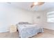 A cozy bedroom featuring a ceiling fan and carpet flooring at 11427 Laurel Brook Ct, Riverview, FL 33569
