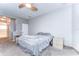 A cozy bedroom featuring a ceiling fan and carpet flooring at 11427 Laurel Brook Ct, Riverview, FL 33569