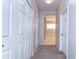 View of hallway featuring carpet flooring and a view to another room at 11427 Laurel Brook Ct, Riverview, FL 33569