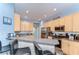 Inviting kitchen boasts a breakfast bar, stainless steel appliances, and modern cabinetry at 11427 Laurel Brook Ct, Riverview, FL 33569