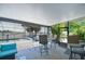 Inviting screened patio with a dining area, bar stools, and pool view at 11427 Laurel Brook Ct, Riverview, FL 33569