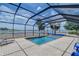 Spacious screened-in pool area with scenic views, perfect for summer fun at 11427 Laurel Brook Ct, Riverview, FL 33569