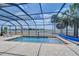 Relaxing screened-in pool area with pavers and lounge chairs offering serene outdoor living at 11427 Laurel Brook Ct, Riverview, FL 33569
