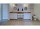 Bright bathroom features double sinks, white cabinets, and neutral tile flooring at 11546 Leisure W Ln, Largo, FL 33773