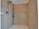 Stand-up shower with tile surround and adjustable shower head at 11546 Leisure W Ln, Largo, FL 33773