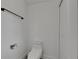 A clean, white bathroom features a toilet, black towel rack and a toilet paper holder at 1208 E 18Th Ave, Tampa, FL 33605