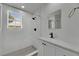 Bright bathroom with window, shower with marble tile, and modern vanity at 1208 E 18Th Ave, Tampa, FL 33605