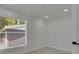 Bright bedroom with a window and luxury vinyl flooring at 1208 E 18Th Ave, Tampa, FL 33605