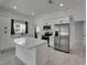 Bright kitchen featuring white cabinets, stainless steel appliances, and a spacious island at 1208 E 18Th Ave, Tampa, FL 33605