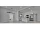 Bright, open-concept kitchen featuring modern stainless steel appliances and stylish white cabinetry at 1208 E 18Th Ave, Tampa, FL 33605