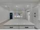 Bright kitchen flows into living space, featuring a white island at 1208 E 18Th Ave, Tampa, FL 33605