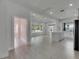 Kitchen and living room combination. Large island in white kitchen at 1208 E 18Th Ave, Tampa, FL 33605
