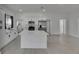 Open concept kitchen with a large island and stainless steel refrigerator at 1208 E 18Th Ave, Tampa, FL 33605