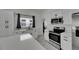 Close-up of a modern kitchen with stainless steel appliances and light countertops at 1208 E 18Th Ave, Tampa, FL 33605