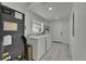 Functional laundry room with modern washer and dryer, and convenient access to a utility door at 1208 E 18Th Ave, Tampa, FL 33605