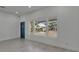 Bright living area with large windows offering a view, creating a welcoming atmosphere at 1208 E 18Th Ave, Tampa, FL 33605