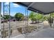 View from a covered front porch with decorative railings showcasing neighborhood charm at 1208 E 18Th Ave, Tampa, FL 33605