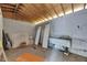 Spacious unfinished room with concrete walls, wood ceiling, and potential for customization at 1208 E 18Th Ave, Tampa, FL 33605