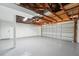 A clean and well-maintained garage with finished floor, ready for parking and storage solutions at 12221 Saddle Strap Row, Hudson, FL 34667