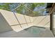 Relaxing screened-in patio with a refreshing swimming pool, perfect for enjoying sunny days and warm evenings at 12221 Saddle Strap Row, Hudson, FL 34667