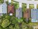 Aerial view showcasing the layout of homes in the neighborhood, with greenery and driveways visible at 12531 Blazing Star Dr, Tampa, FL 33626